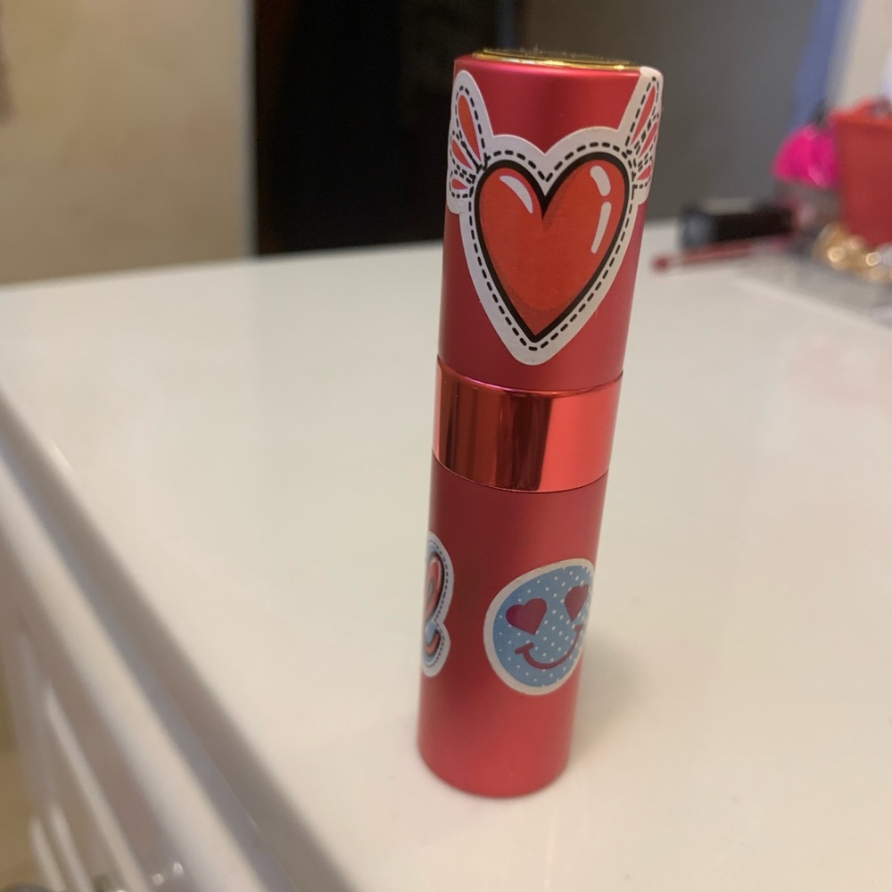 Perfume slightly used but still great in fun travel carrier 🥰